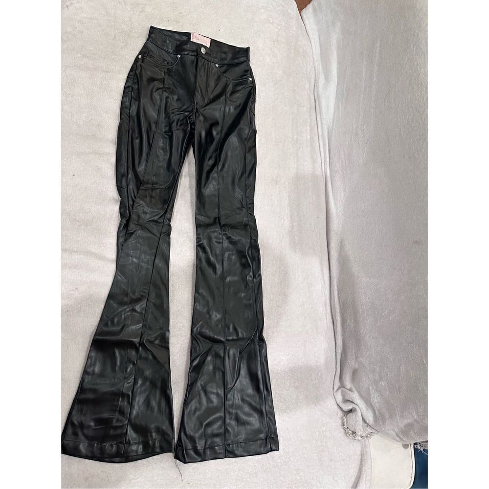 REVICE size 24 black leather pants women’s with huge star on the back